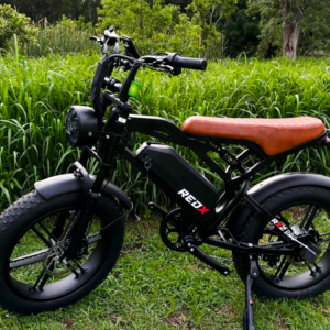Red X RX2 Pro fat bike ebike with brown leather seat on grass